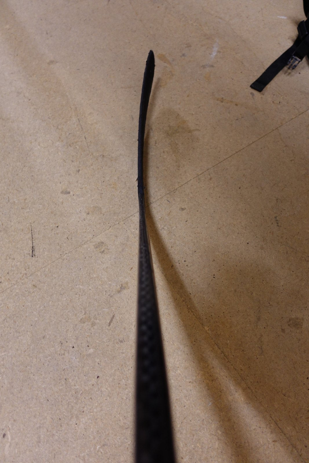 Blade of Leon Draisaitl's pro stock hockey stick photographed from above, showing the flat curve