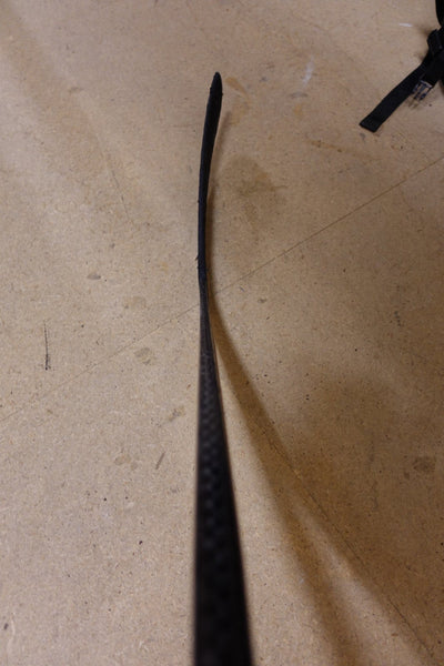 Blade of Leon Draisaitl's pro stock hockey stick photographed from above, showing the flat curve