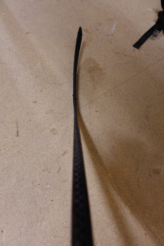 Blade of Leon Draisaitl's pro stock hockey stick photographed from above, showing the flat curve