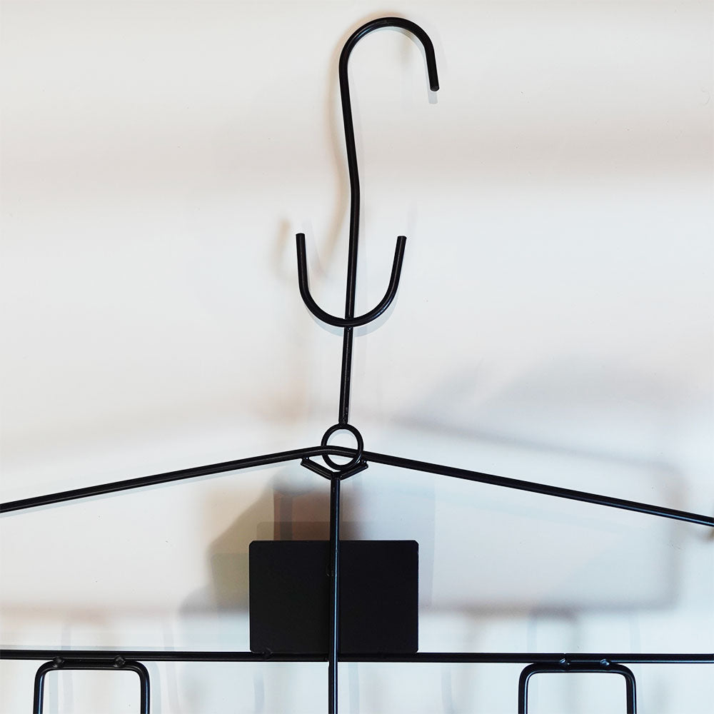 upper part of a black ice hockey equipment hanger