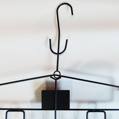 upper part of a black ice hockey equipment hanger