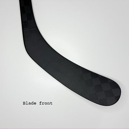 Ice hockey stick blade A90TM as well as A92 similar to P90TM and P92 of bauer. Background is white. Text in the picture is "Blade front". The carbon pattern of the blade is clearly visible. It is a close up of only the blade of the ice hockey stick. The stick is named lunar 1.0 and is highest quality on the market.