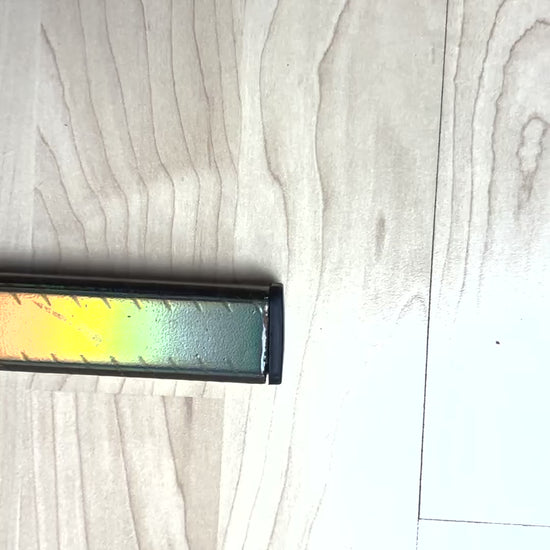 Video of Lunar 1.0 ice hockey stick, Lunar 1.0 Eishockeystock, Top Modell filmed from above, you can see the rainbow holo design mirroring the camera and close up spiral grip. filmed from top to bottom.